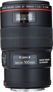 Photo of the Canon 100mm prime macro lens with a red line around the body indicating it's an l-series lens.